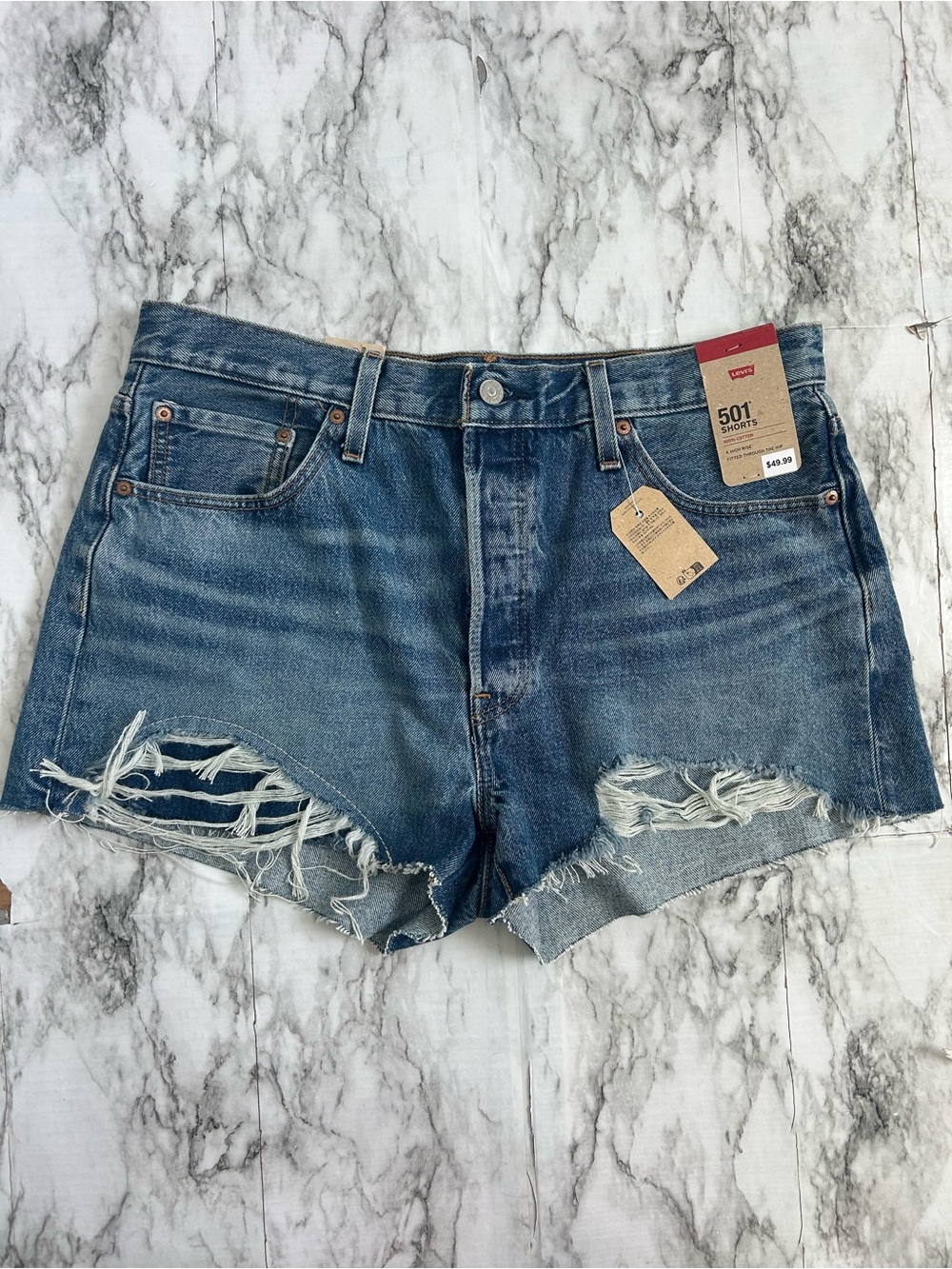 Levi's | NWT women’s size 34 A High Rise Distressed Light Blue Jean Shorts 501